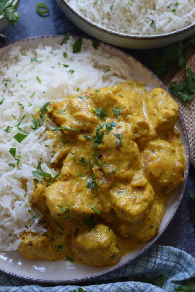 Chicken Masala on a plate with basmati rice.