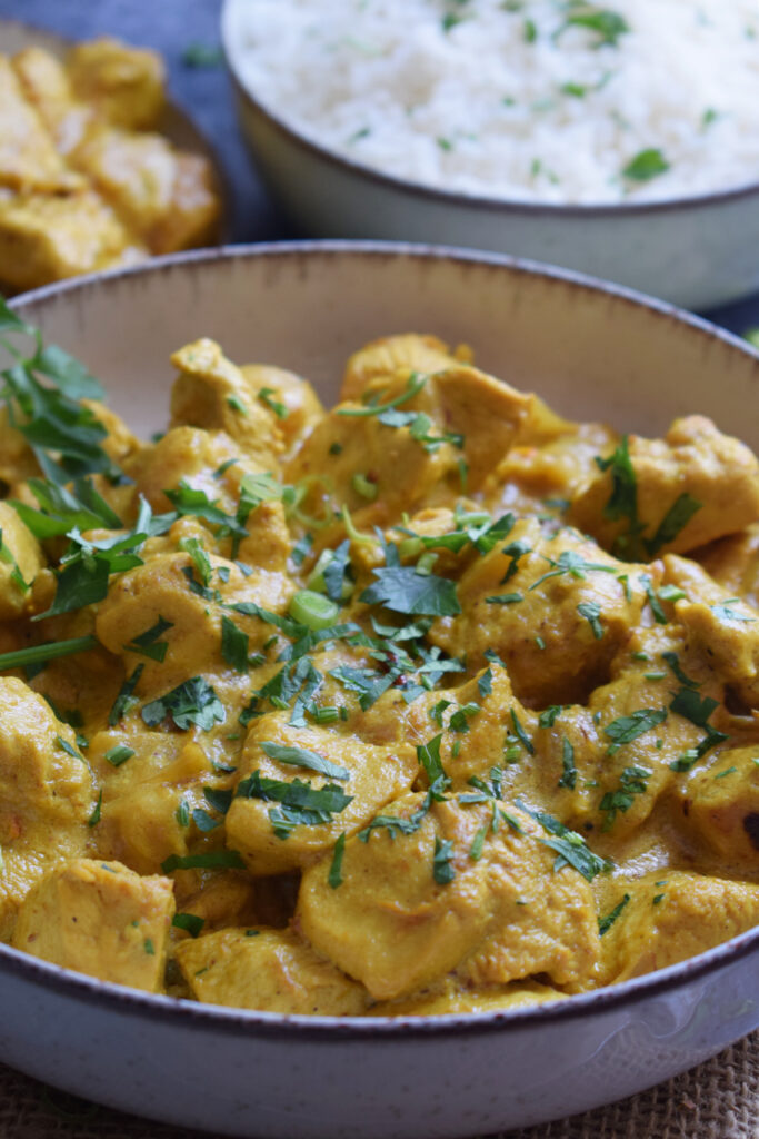 Close up of chicken masala with cilantro.