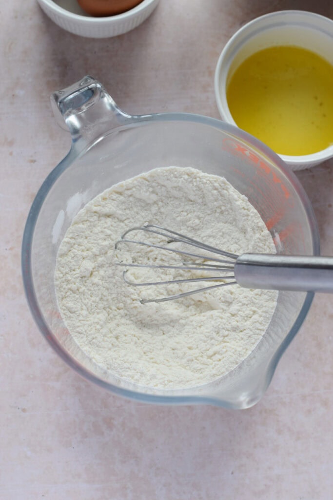 Combine dry ingredients in a glass bowl for waffles.