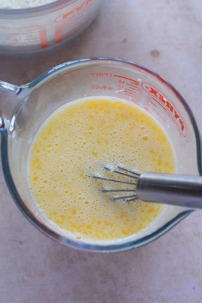 Combine wet ingredients in a glass bowl for waffles.