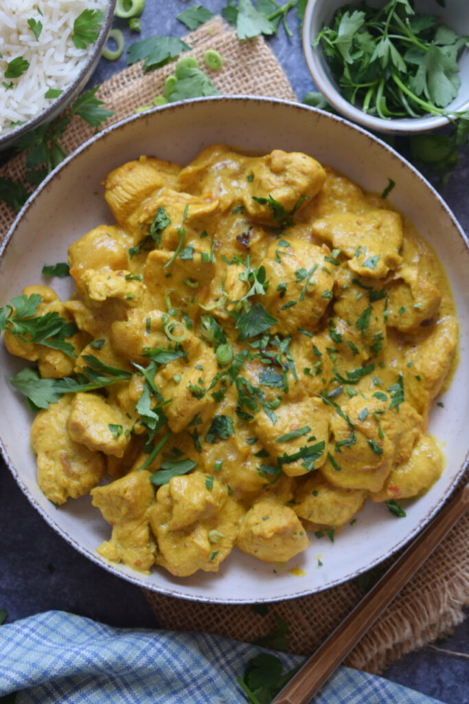 Spiced creamy chicken masala in a bowl.