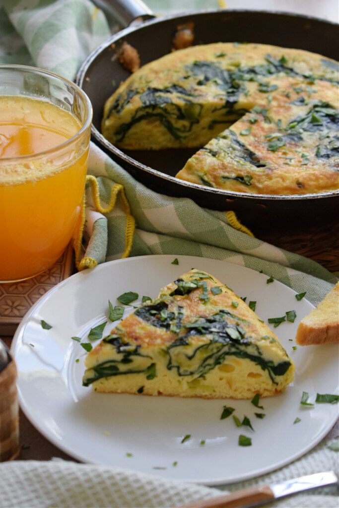 Frittata on a plate with juice.