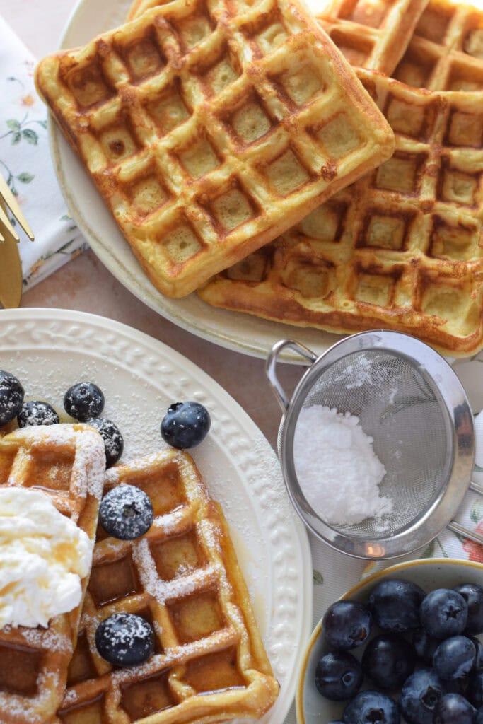 Buttermilk waffles on a serving plate.