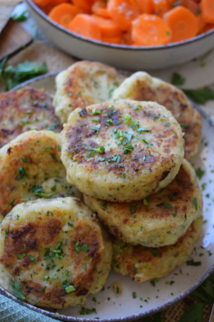 A stack of fish cakes with carrots.