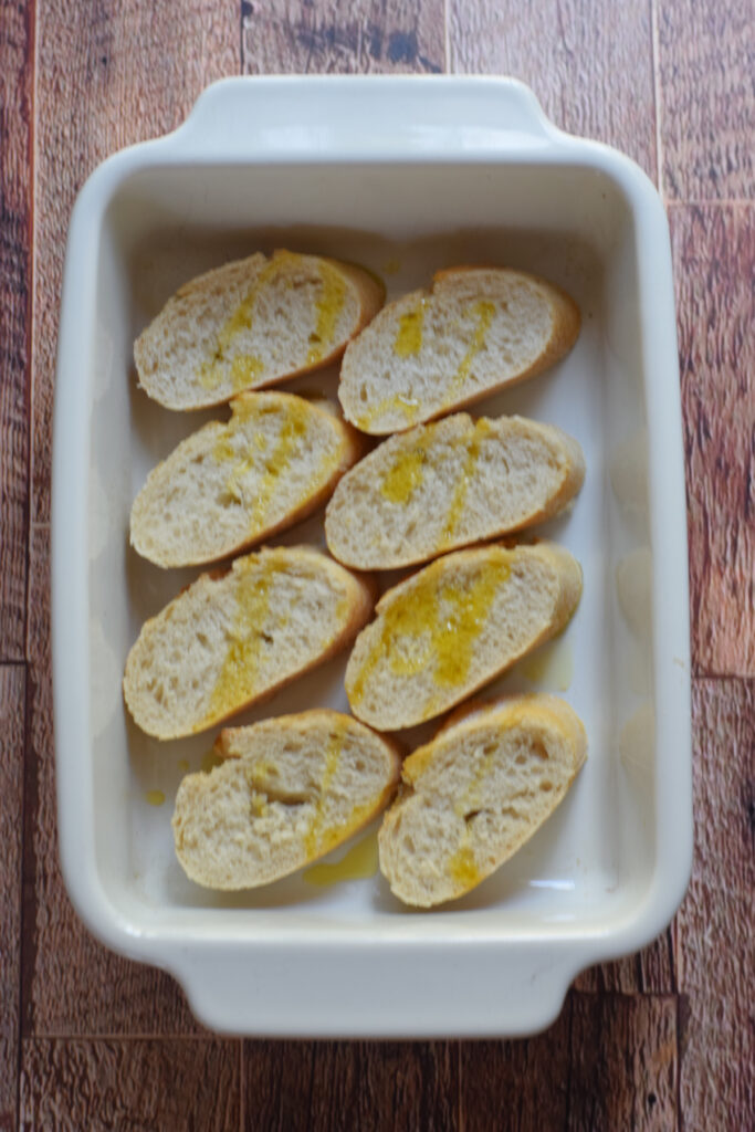 Baked crispy bread in a baking dish.