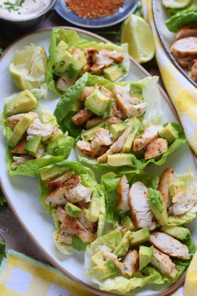 Chicken salad cups on a white plate.