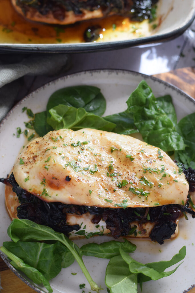 Stuffed chicken breast on a plate.