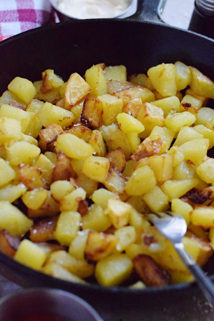 Skillet country fries in a skillet.
