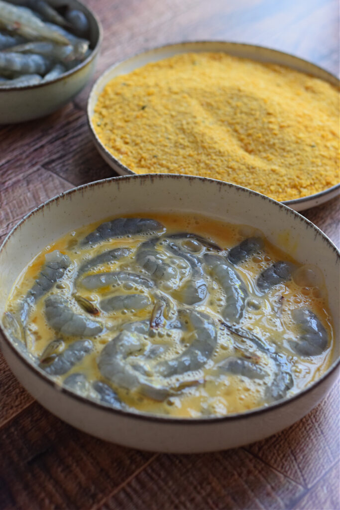 Shrimp dipped in beaten egg.