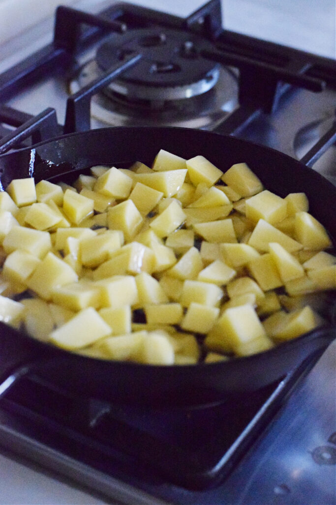 Cooking potatoes in a skillet.