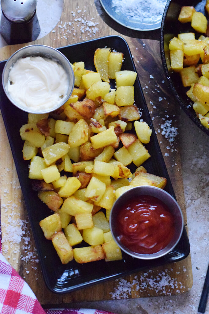 Skillet fires on a black plate.