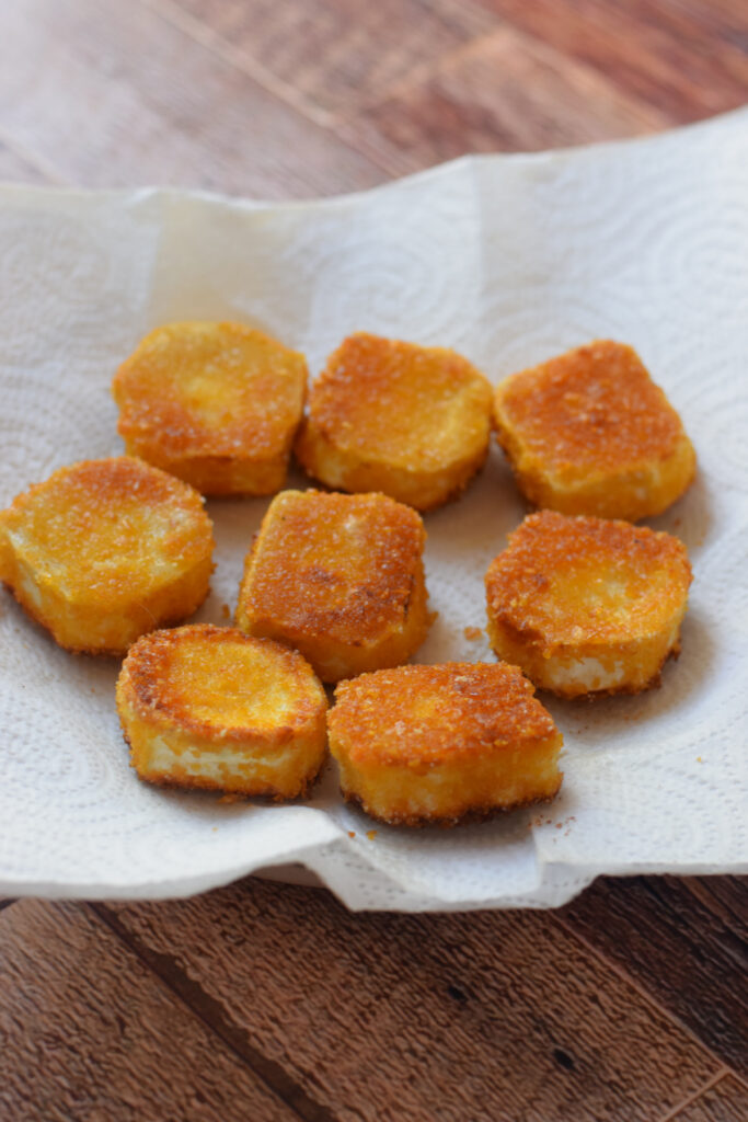 Fried goat cheese on paper towels.