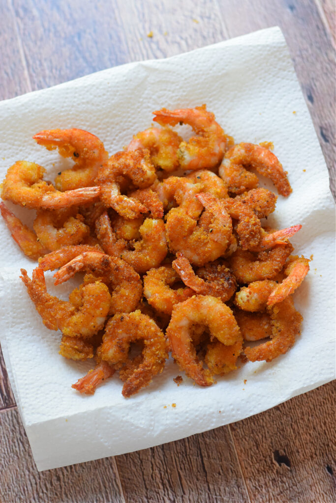 Fried shrimp on paper towels.