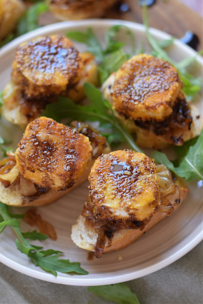 Close up of fried goat cheese on a plate.