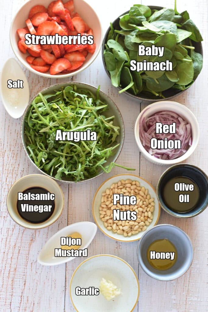 Ingredients to make a strawberry spinach salad.