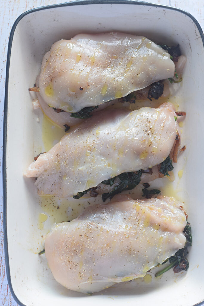 Chicken breast in a casserole dish.