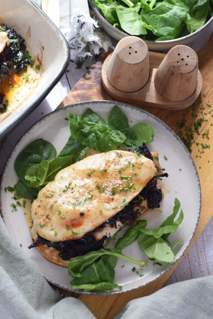 Stuffed chicken on a plate.