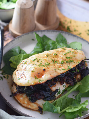 Stuffed chicken breast with caramelized onions and spinach.