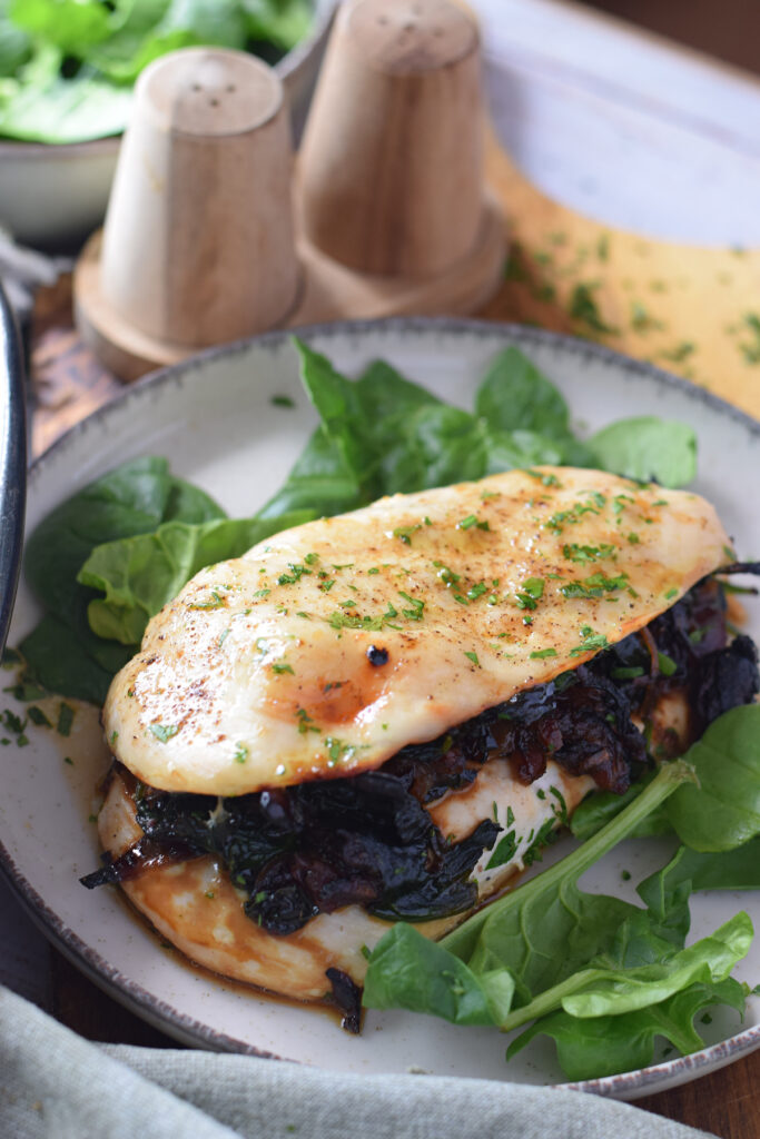 Stuffed chicken breast with caramelized onions and spinach.