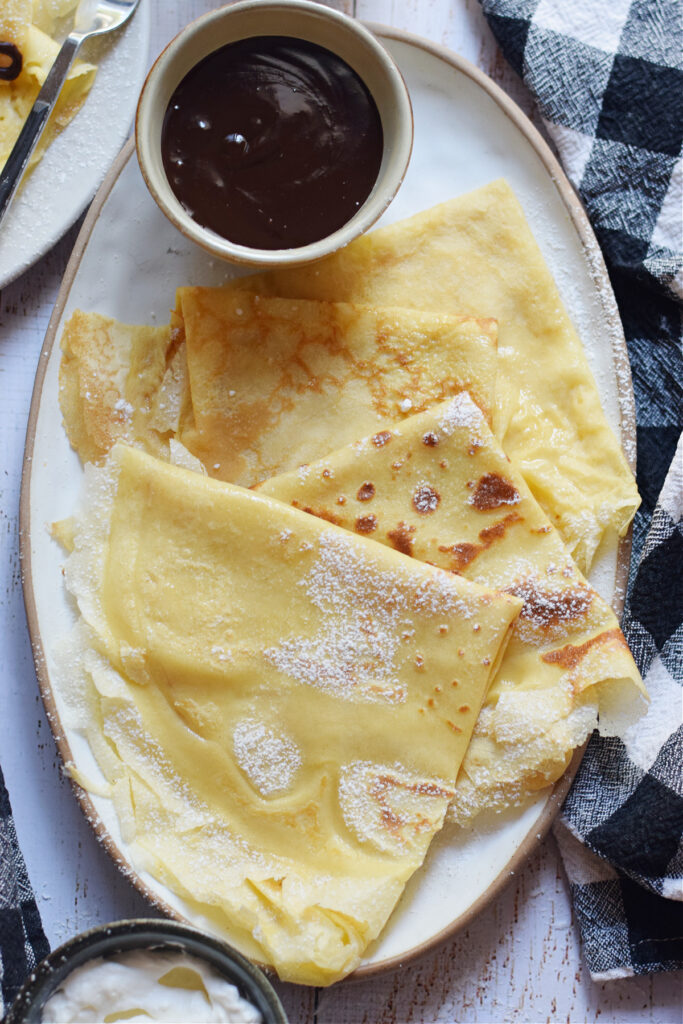 Crepes on a small platter.