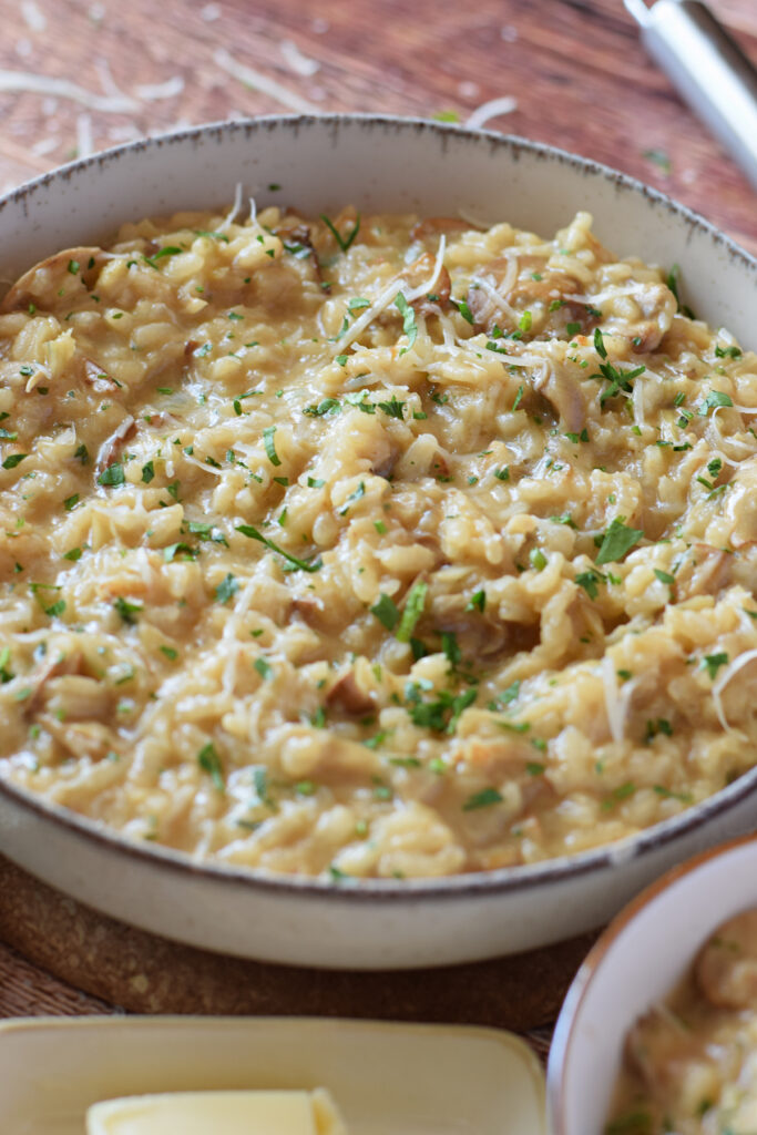 Close up of mushroom and leek risotto in a bowl.