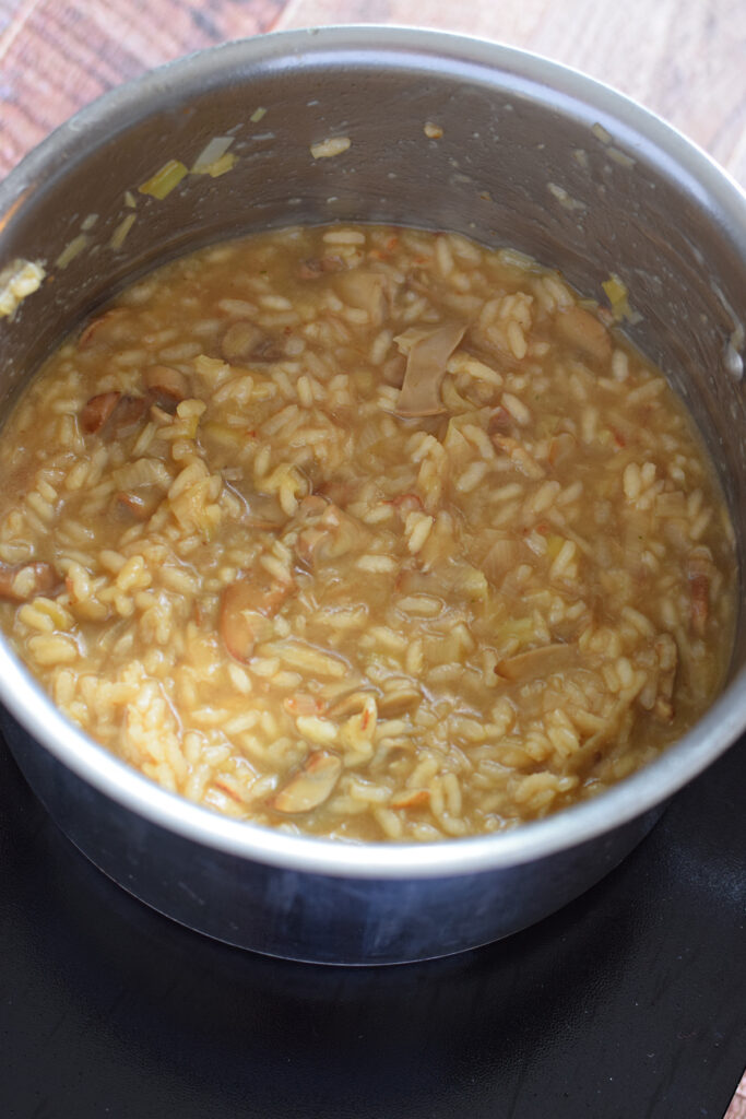 Making risotto in a saucepan.