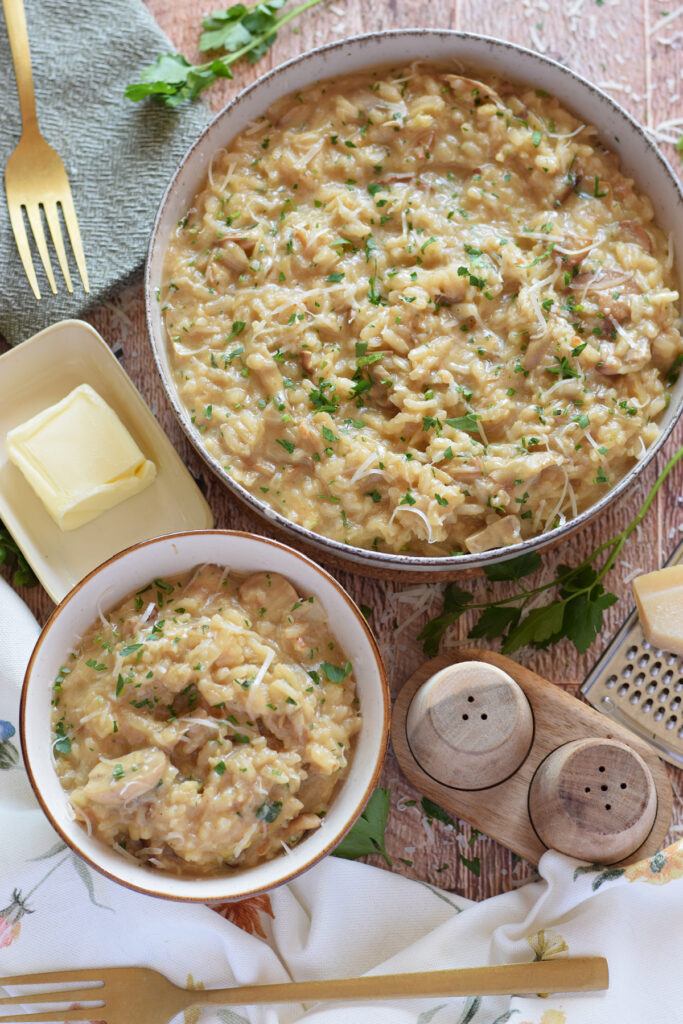 Risotto in serving dishes with butter in a dish.