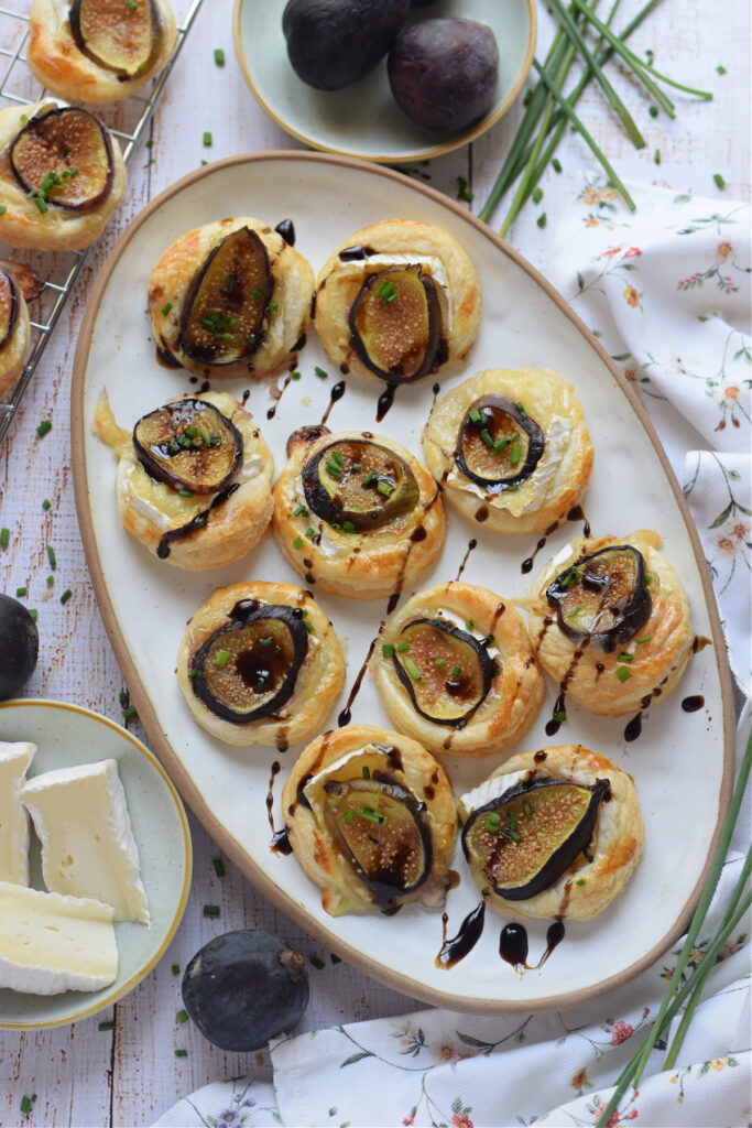 Puff pastry tarts on a white plate.