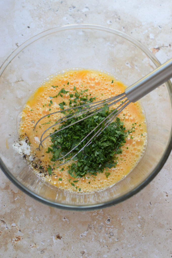 Wake up to this Zucchini Parmesan Frittata this weekend. Light and fluffy eggs filled with sharp Parmesan cheese and thinly sliced sauteed zucchini. This frittata is completely cooked on the stove top so there is no oven required to finish it off. Make it for your next weekend brunch.