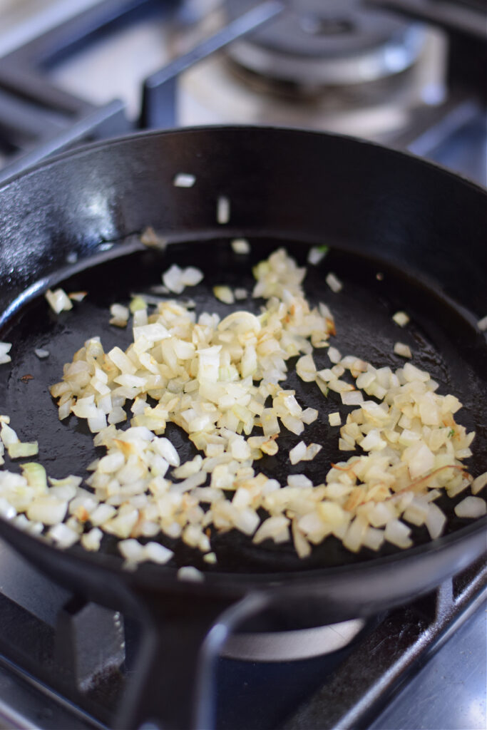 Cooked onions in a skillet.