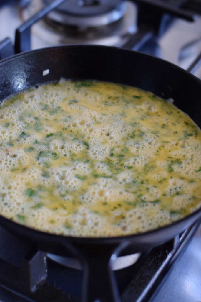 Making a frittata in a skillet.