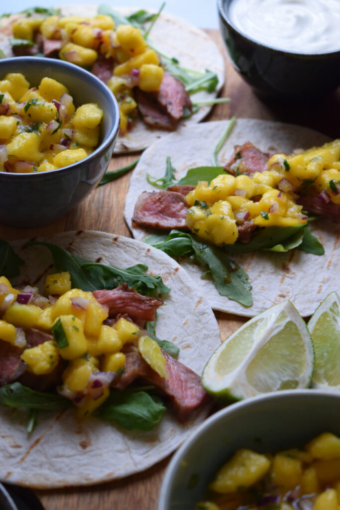 Steak tacos with mango salsa.