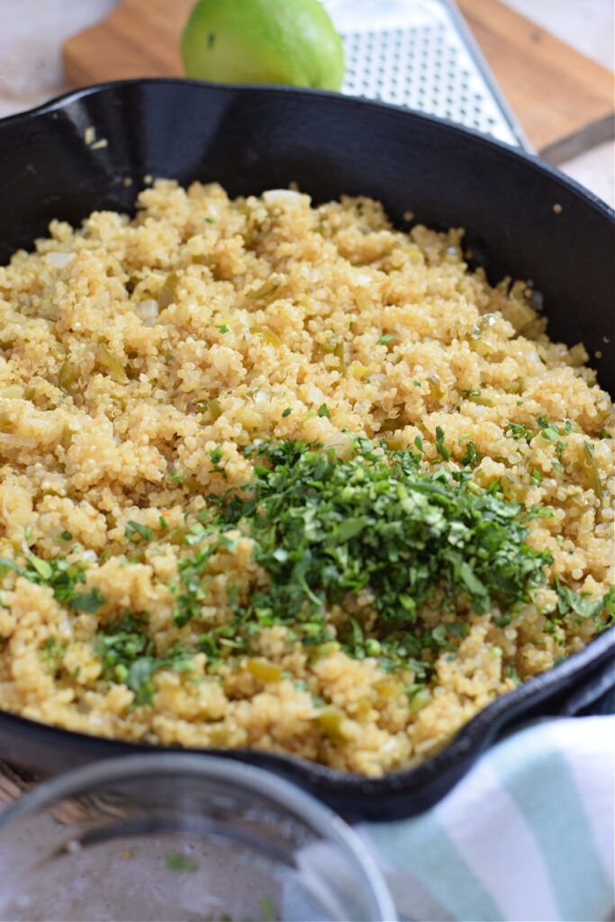 Quinoa with cilantro in a skillet.