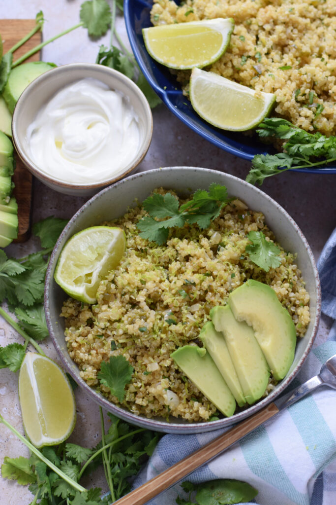 Cilantro lime quinoa in a bowl with avocados.