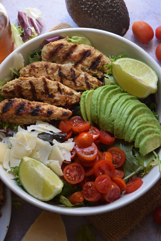 Chicken with avocados and cherry tomatoes.