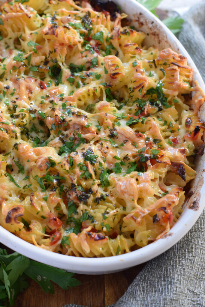 Cheesy pasta bake in a casserole dish.