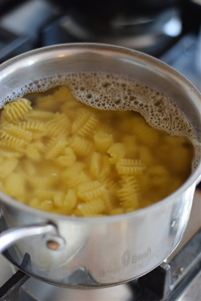 Cooking pasta in a saucepan.