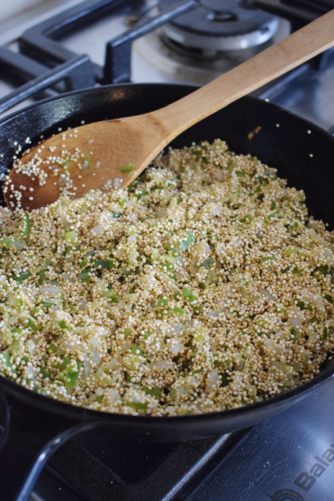 Cooking quinoa in a skillet.