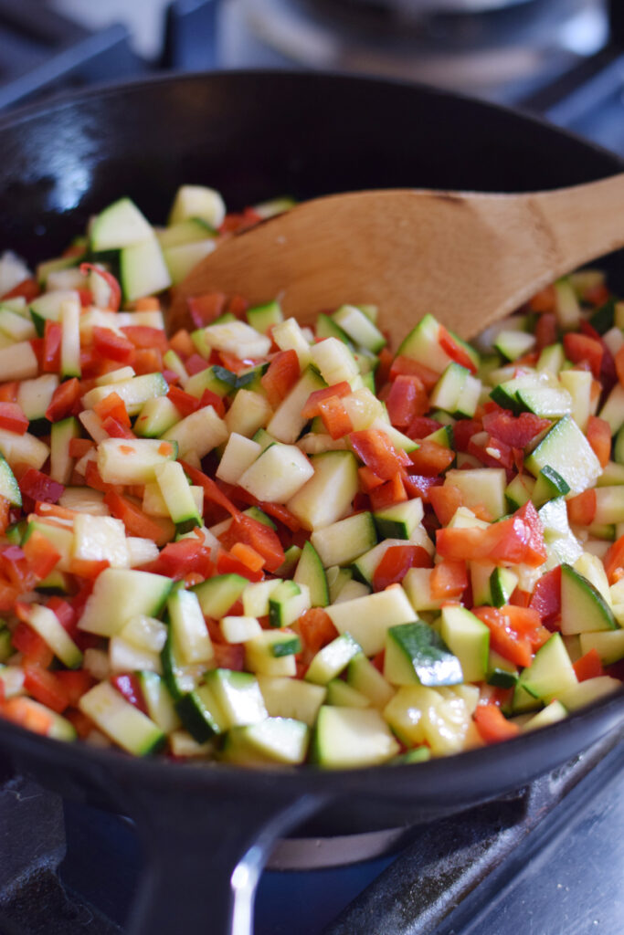 Cooking vegetables in a skillet.