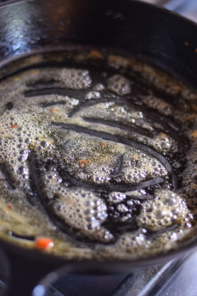 Melting butter in a skillet.