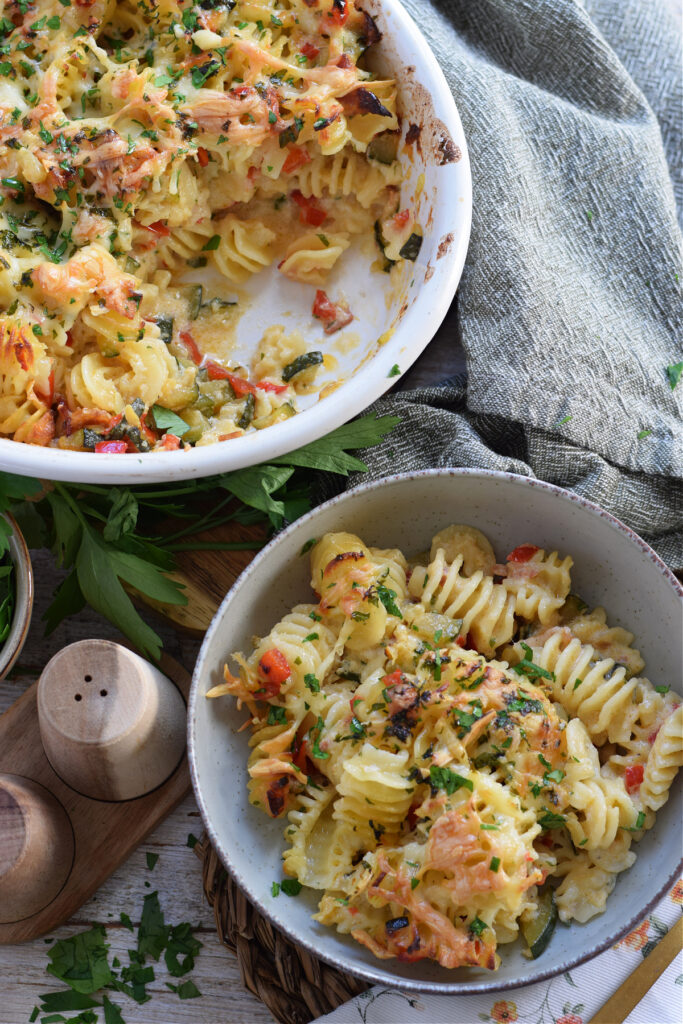 Bacon and zucchini pasta bake in a serving dish.