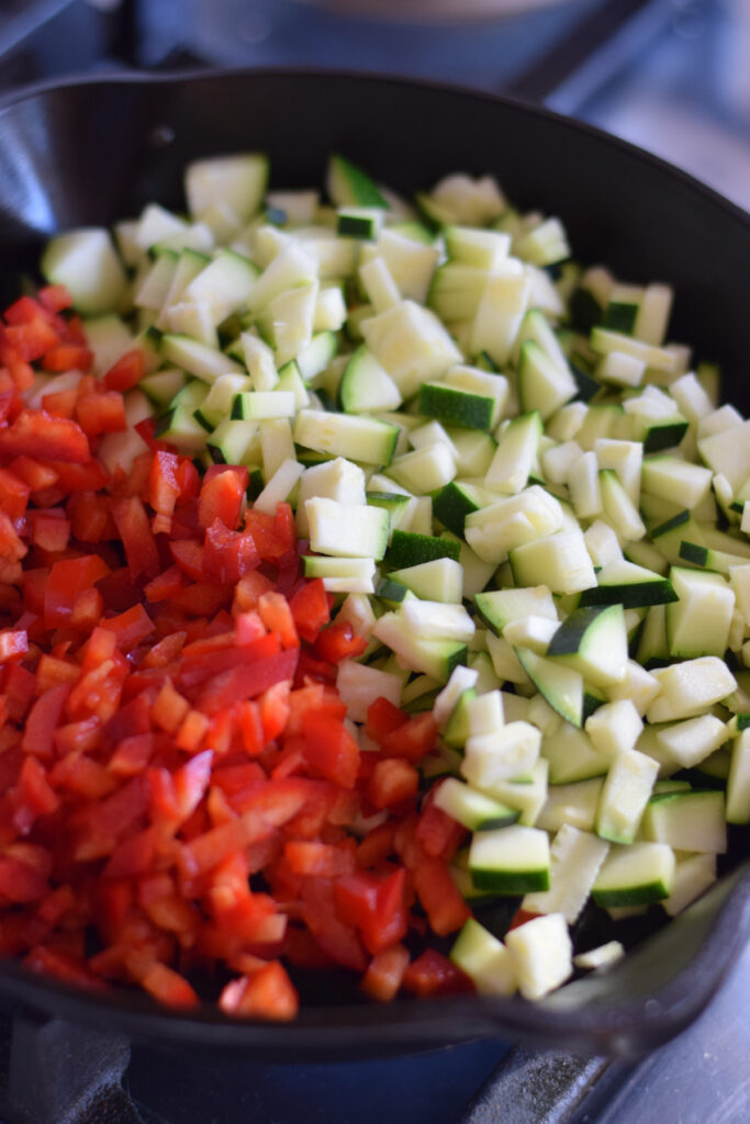 Cooking vegetables in a skillet.