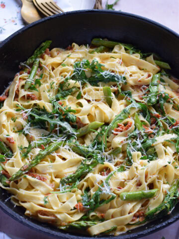 Sun dried tomato tagliatelle in a skillet.