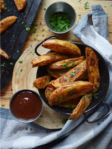 over head table view of spiced potato wedges