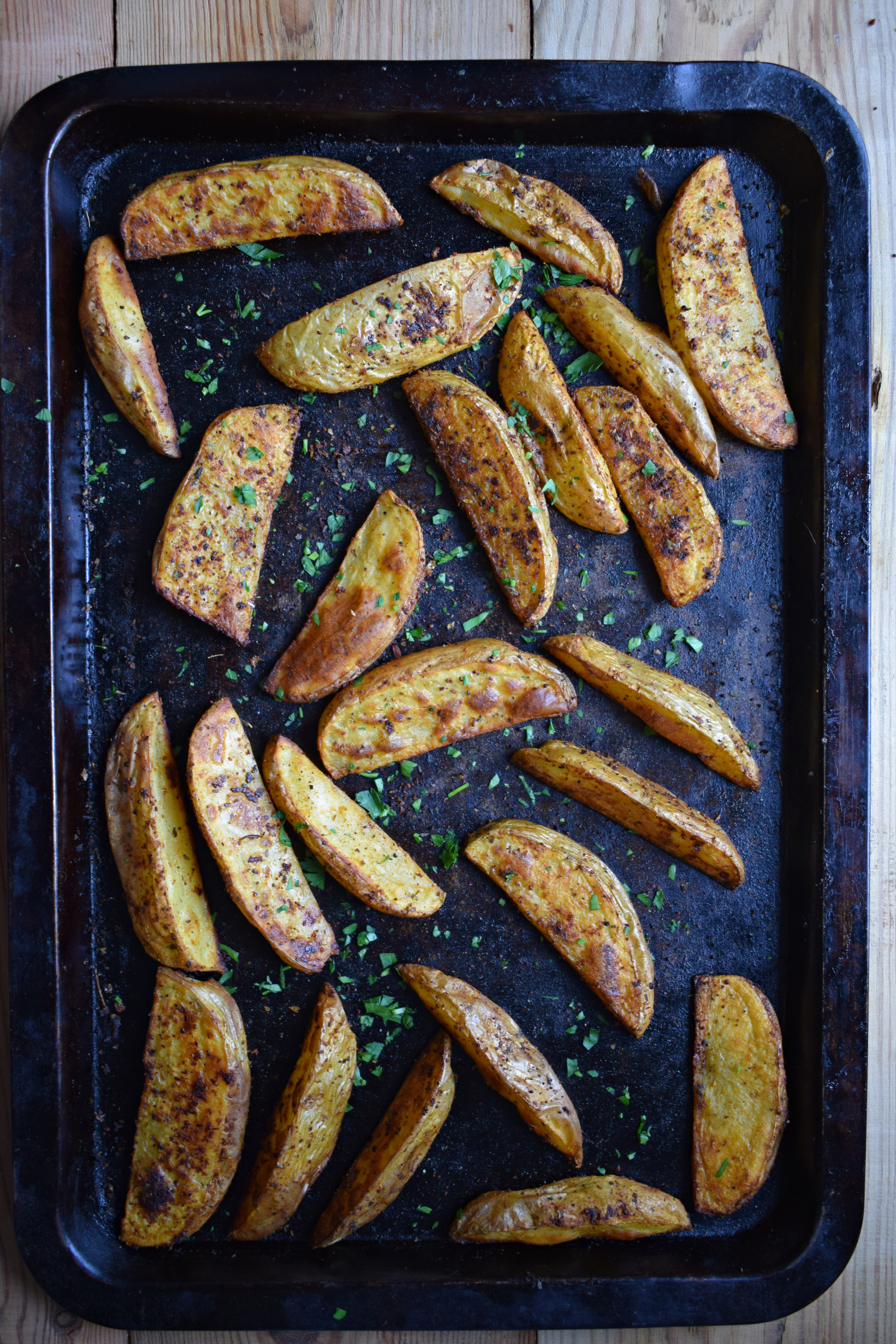 Paprika Spiced Potato Wedges on a baking tray