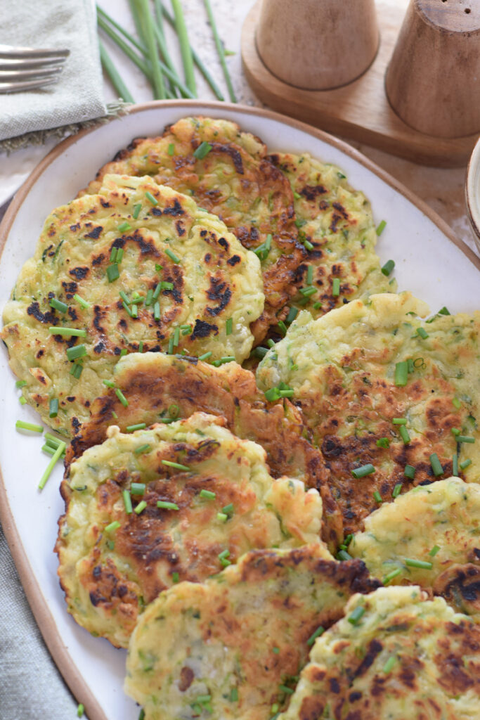 Close up of zucchini fritters recipe on a plate.