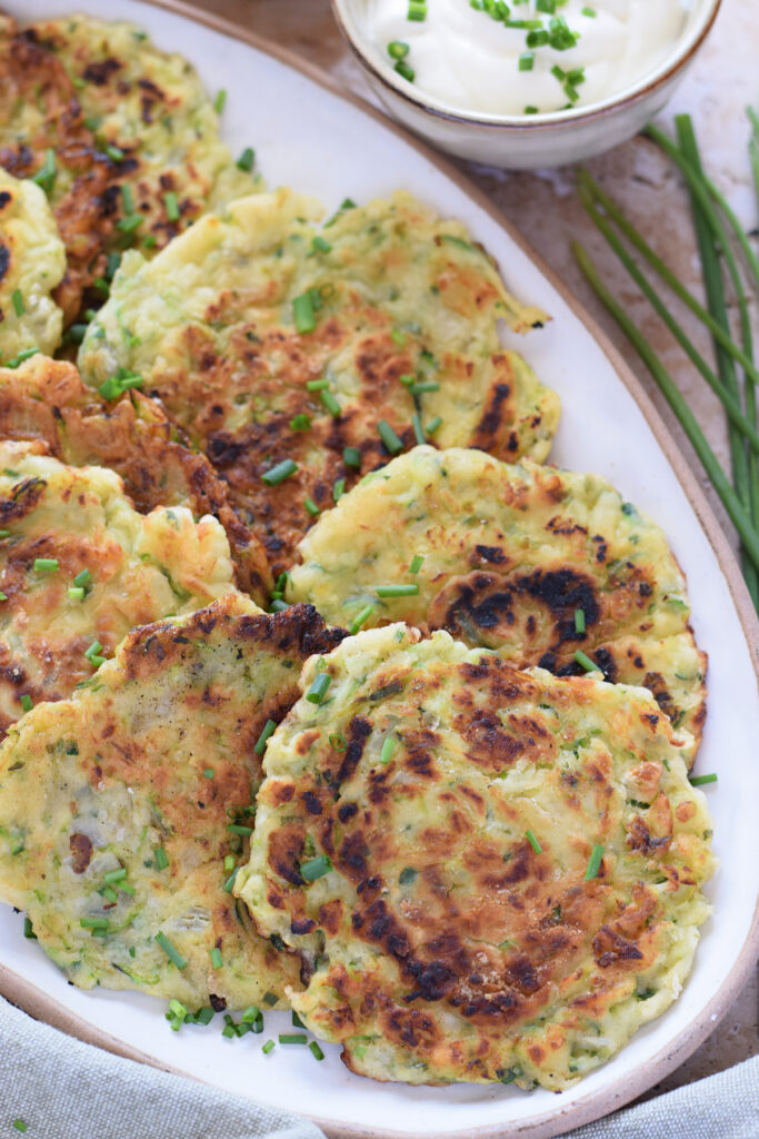 Close up of zucchini fritters on a plate.