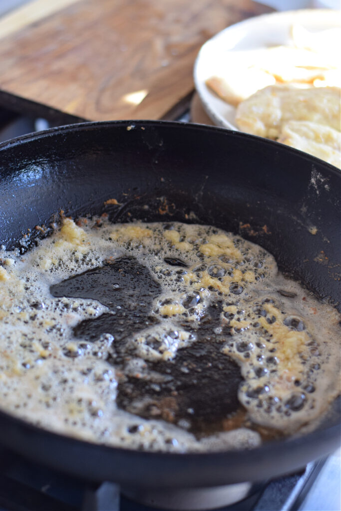 Cooking butter in a skillet.