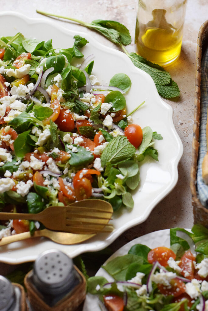 Tomato salad with feta cheese and mint leaves.