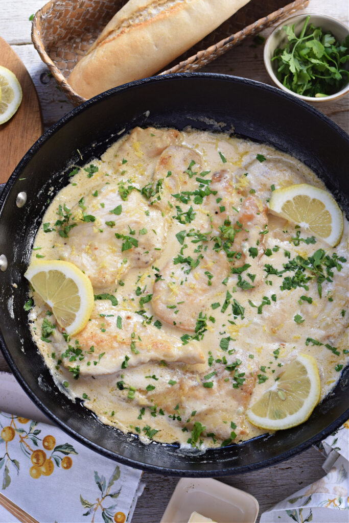 Lemon cream chicken in a skillet.